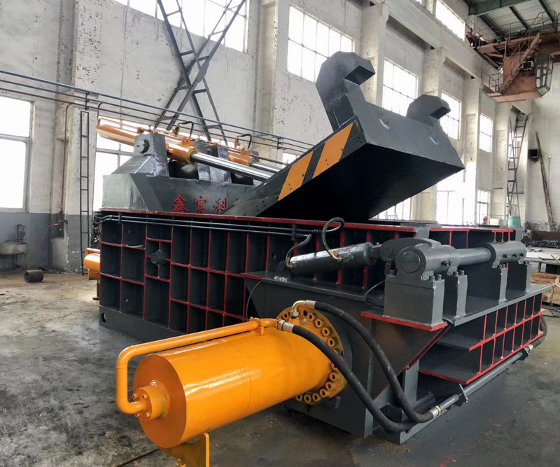 What is a scrap metal baler?